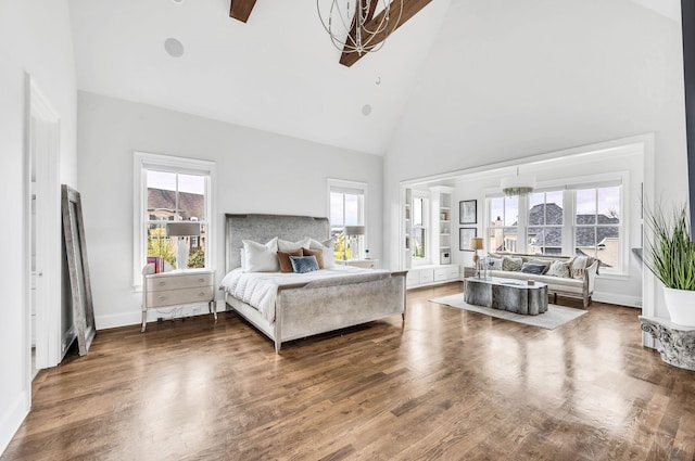 bedroom with ceiling fan, dark wood-type flooring, high vaulted ceiling, and multiple windows