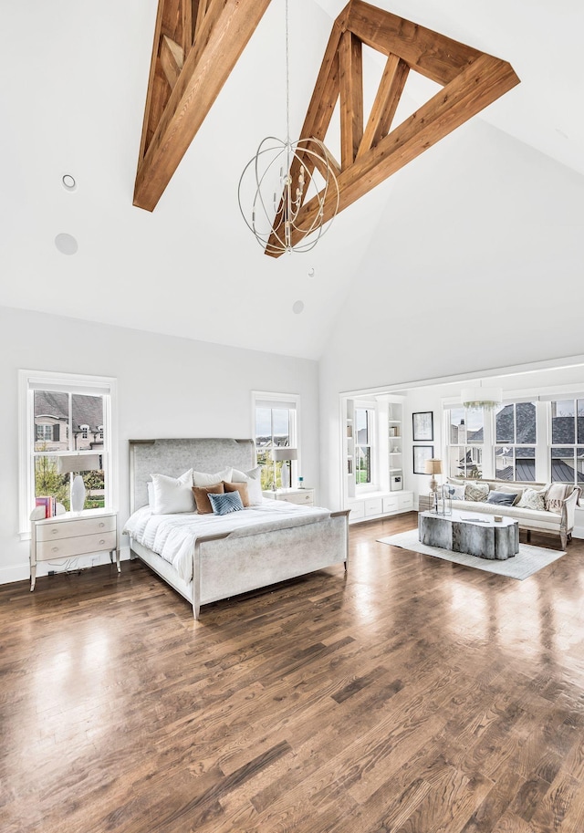 bedroom with beamed ceiling, a notable chandelier, dark hardwood / wood-style flooring, and high vaulted ceiling