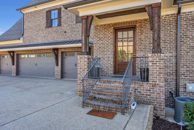 property entrance featuring central AC and a garage