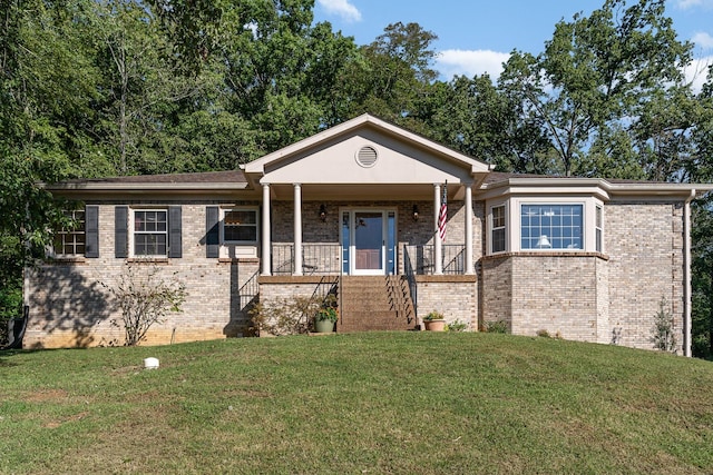 view of front of property with a porch and a front lawn