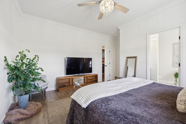 bedroom with ceiling fan, crown molding, connected bathroom, and hardwood / wood-style flooring