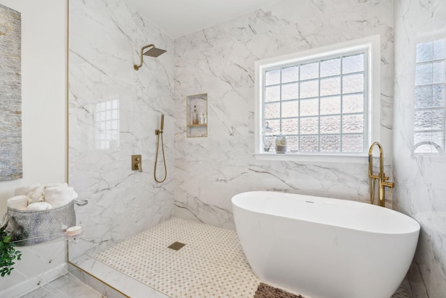 bathroom featuring shower with separate bathtub