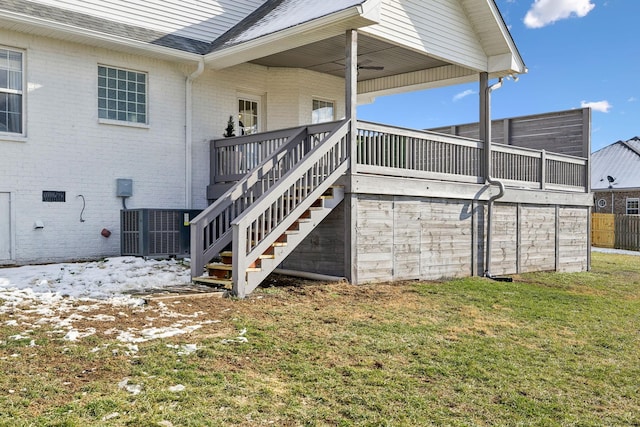 view of property exterior featuring ceiling fan and a lawn