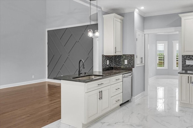 kitchen featuring stainless steel dishwasher, crown molding, sink, pendant lighting, and white cabinets