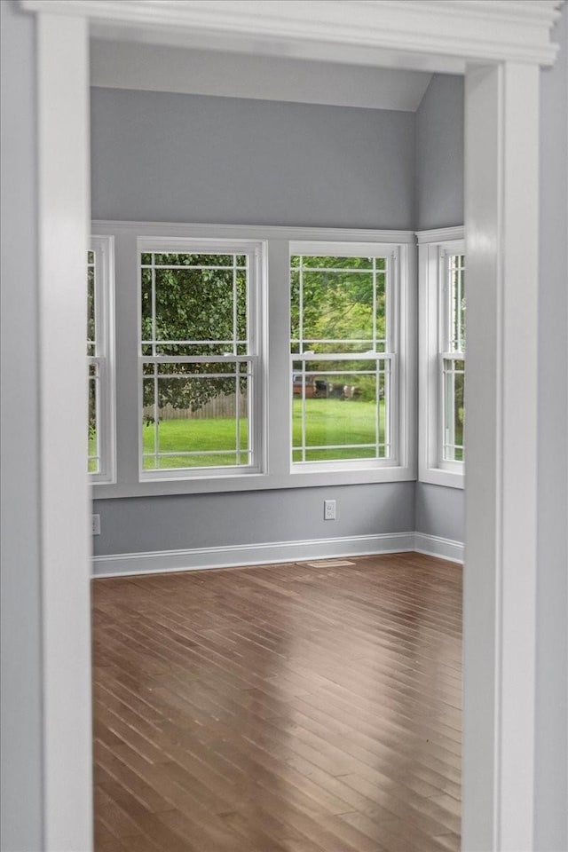 spare room featuring dark hardwood / wood-style floors