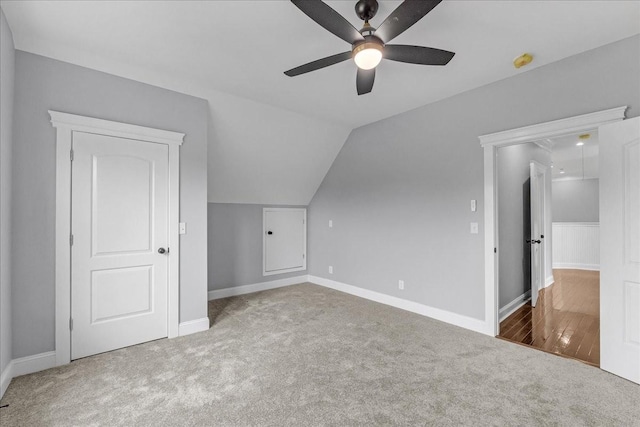 bonus room featuring ceiling fan, carpet floors, and vaulted ceiling