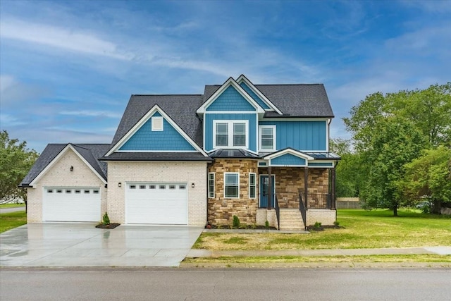 craftsman inspired home with a porch, a garage, and a front lawn