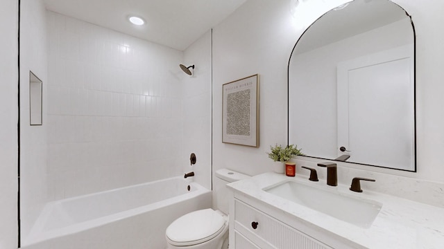 full bathroom featuring vanity, toilet, and tiled shower / bath