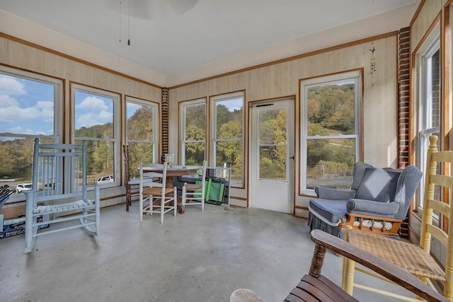 sunroom / solarium with ceiling fan