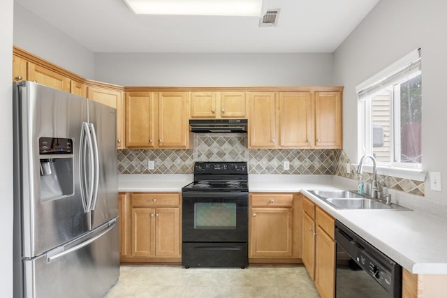 kitchen with sink, tasteful backsplash, and black appliances