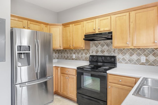 kitchen featuring decorative backsplash, stainless steel fridge, sink, and black range with electric cooktop