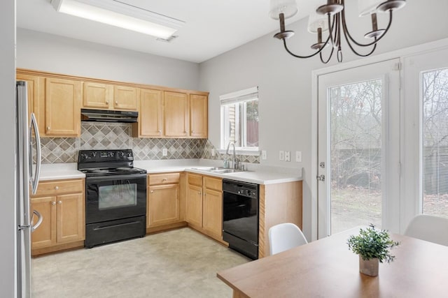 kitchen featuring sink, backsplash, an inviting chandelier, and black appliances