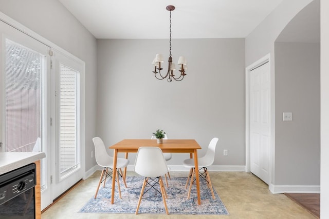 dining space featuring an inviting chandelier