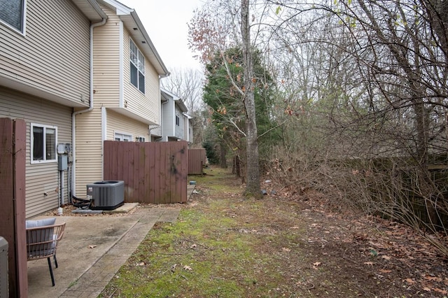 view of yard featuring a patio and cooling unit