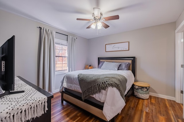 bedroom featuring ceiling fan and dark hardwood / wood-style flooring