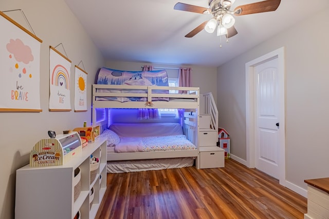 bedroom featuring ceiling fan and dark wood-type flooring