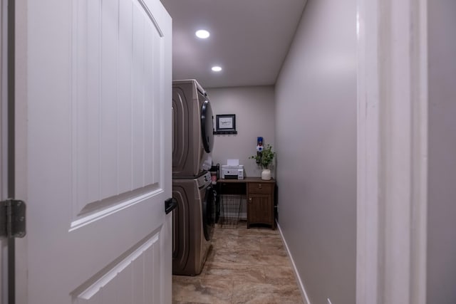 corridor with stacked washer / dryer