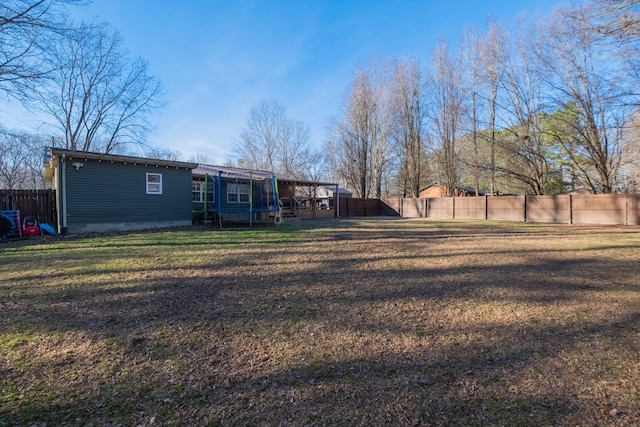 view of yard featuring a trampoline