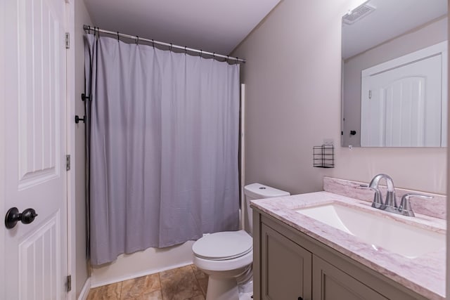 full bathroom featuring vanity, toilet, and shower / tub combo