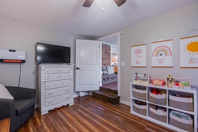 game room featuring dark hardwood / wood-style floors and ceiling fan