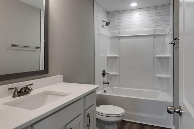 full bathroom with hardwood / wood-style floors, vanity, toilet, and bathtub / shower combination