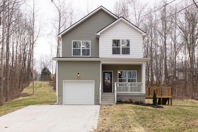 view of front property featuring a front yard, a porch, and a garage