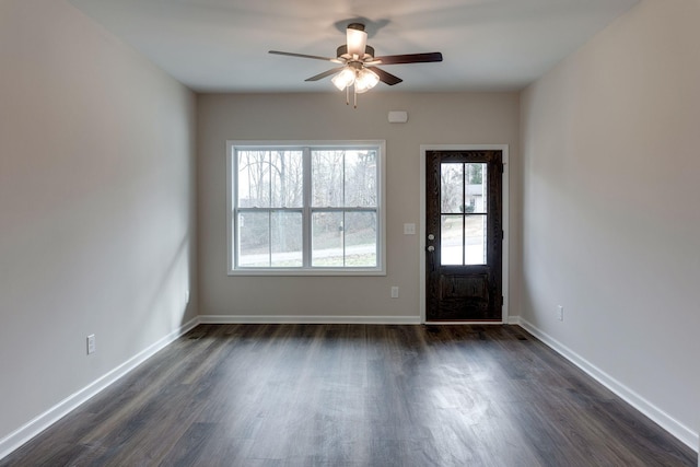 foyer with ceiling fan and dark hardwood / wood-style floors