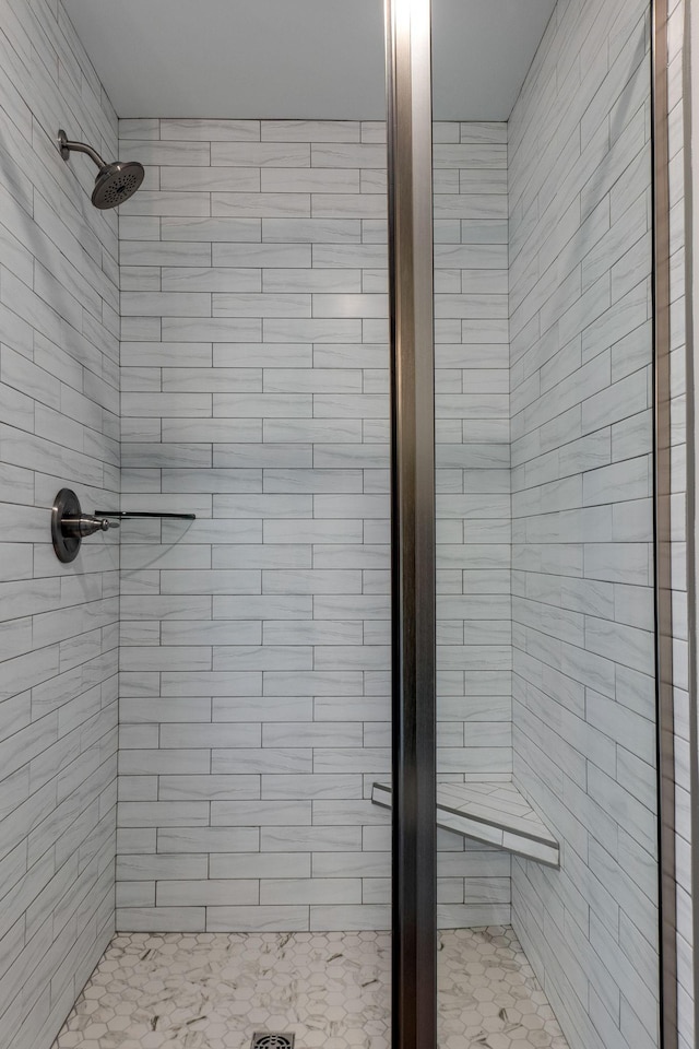 bathroom with tiled shower