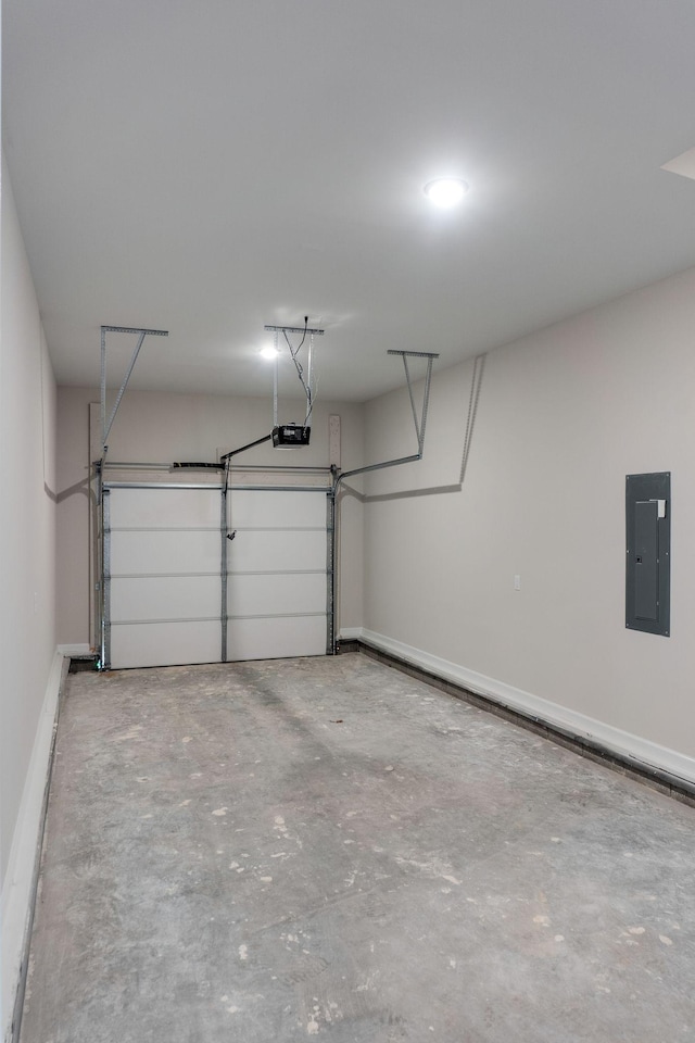 garage featuring electric panel and a garage door opener