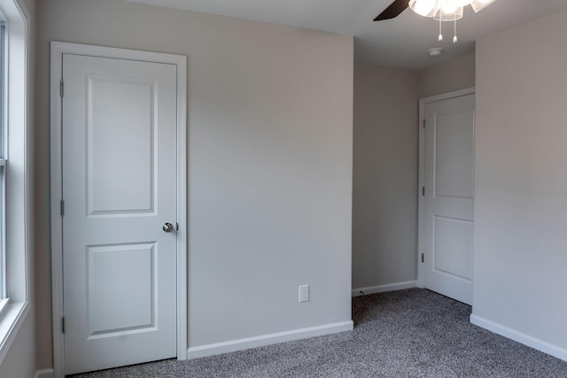 carpeted empty room with ceiling fan