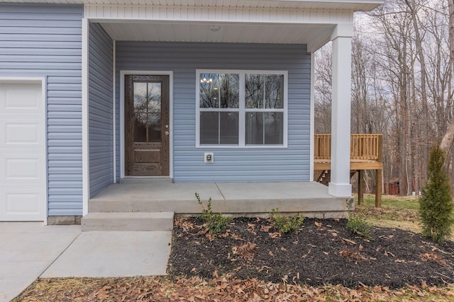 view of exterior entry featuring a porch