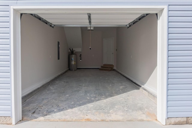 garage featuring gas water heater and a garage door opener