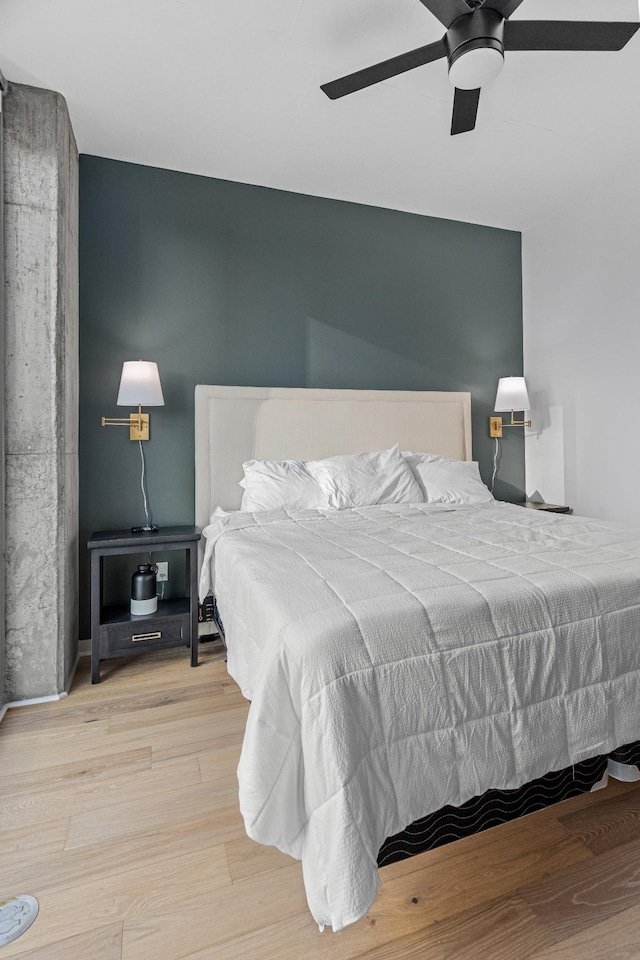 bedroom featuring ceiling fan and light hardwood / wood-style floors