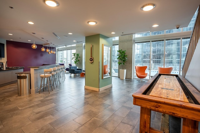 recreation room featuring bar area