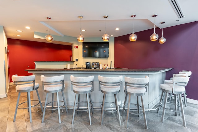 bar featuring decorative light fixtures