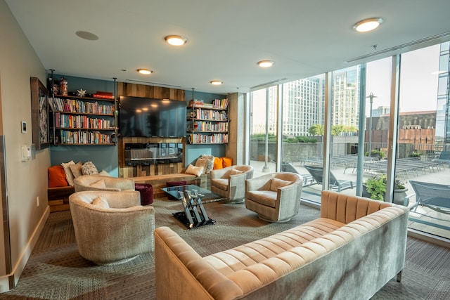 sitting room with carpet and expansive windows