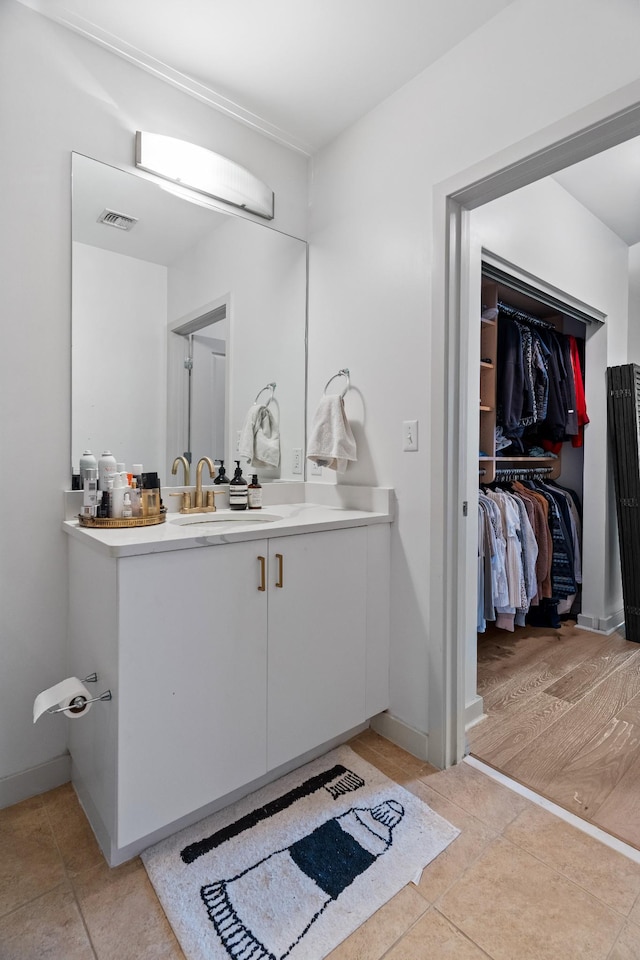 bathroom featuring tile patterned floors and vanity