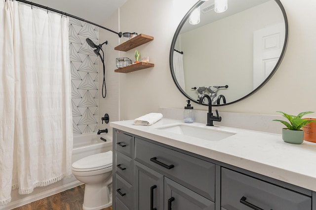 full bathroom with shower / bathtub combination with curtain, vanity, hardwood / wood-style flooring, and toilet