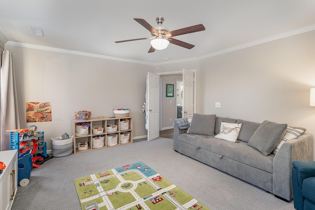 living room with ceiling fan, light colored carpet, and ornamental molding