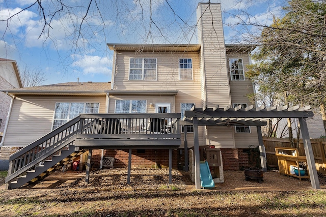 back of house featuring a deck