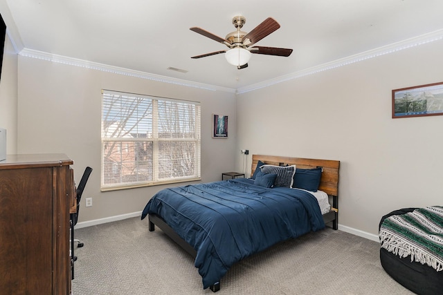 bedroom with ceiling fan, ornamental molding, and light carpet