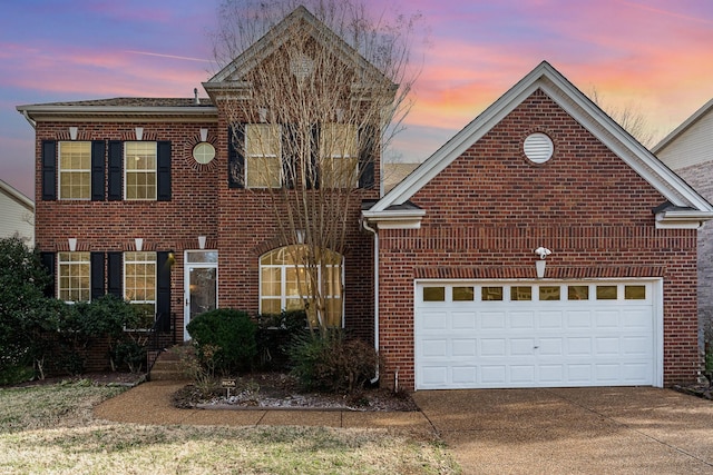 view of front of property with a garage