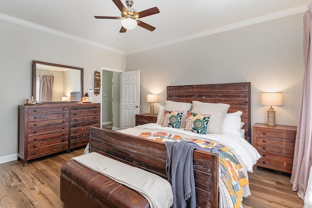 bedroom featuring crown molding, ceiling fan, and light wood-type flooring