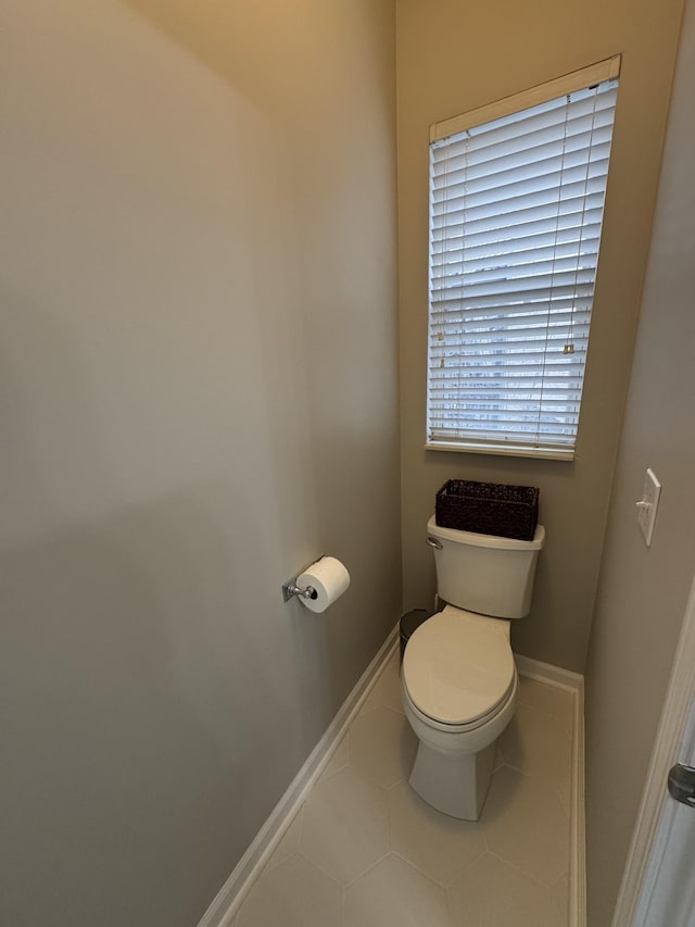 bathroom featuring tile patterned flooring and toilet