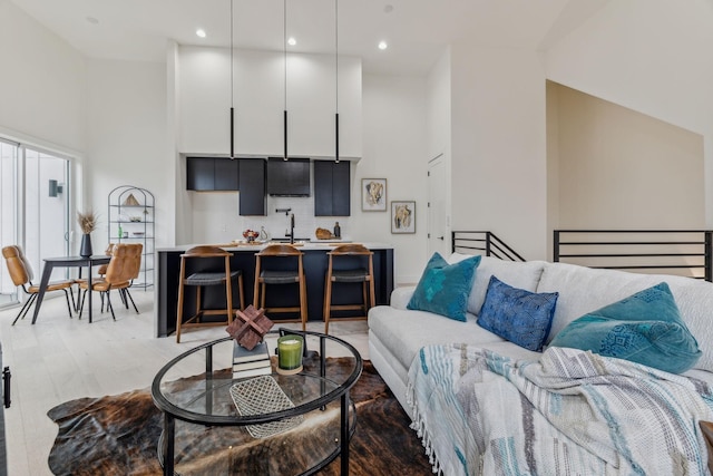 living room with high vaulted ceiling