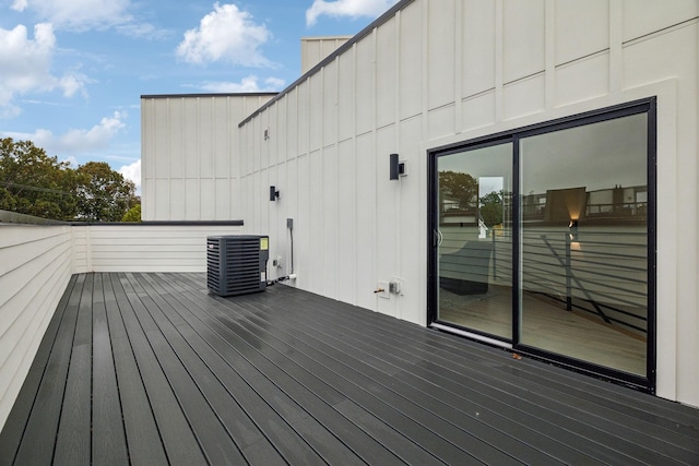 wooden terrace featuring cooling unit