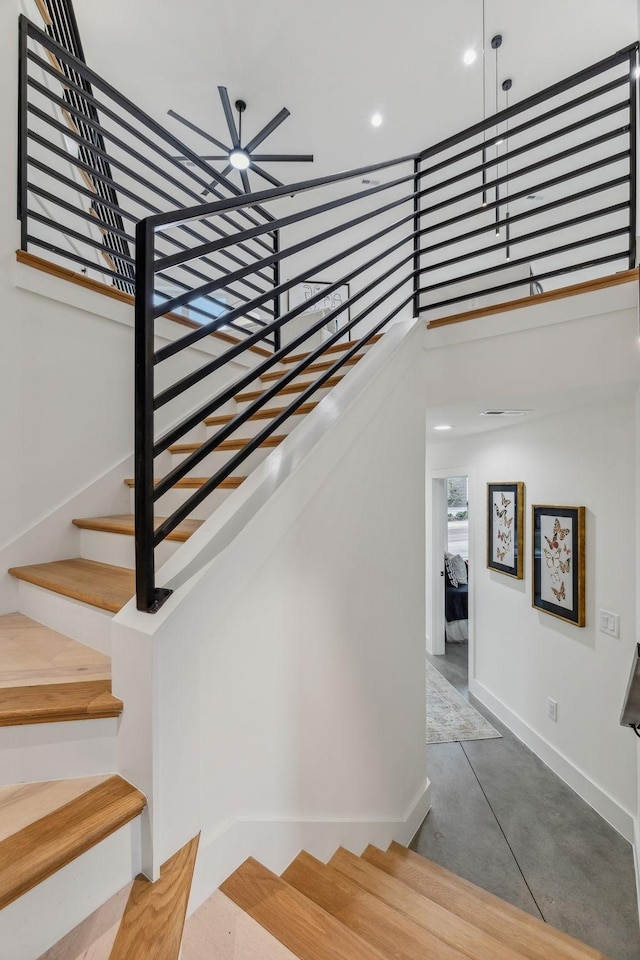 staircase with concrete floors