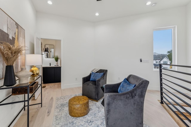 sitting room featuring light hardwood / wood-style floors