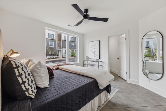 bedroom featuring ceiling fan and light carpet