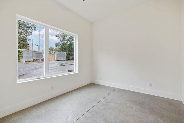 spare room featuring concrete floors